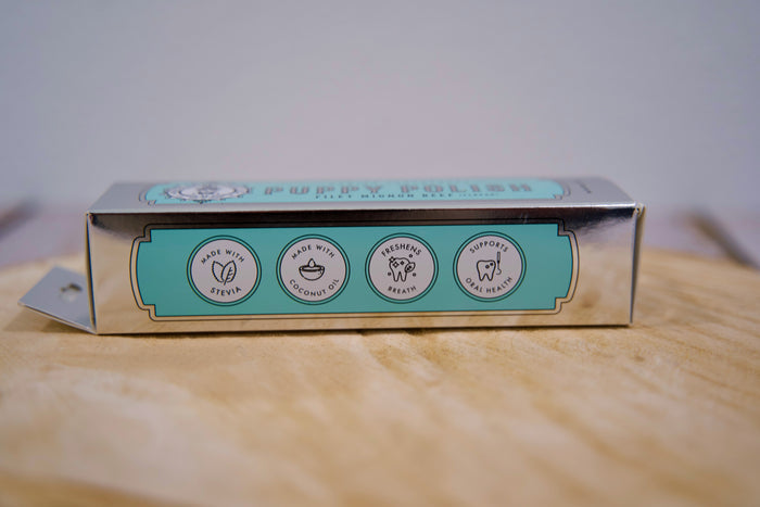 Dog Toothpaste box with green label.|Boîte de dentifrice pour chiens avec une étiquette verte.