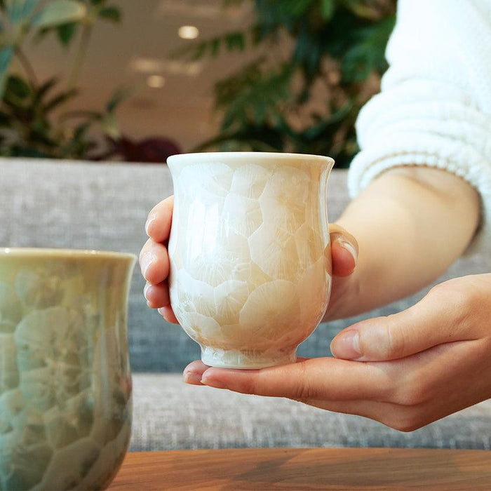 Handcrafted Kyoto-Kiyomizu ware yunomi tea cup with flower crystal glaze held in both hands | Touan, Kyoto