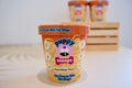 Puppy Scoops peanut butter ice cream mix for dogs in a container with a pink label.|Mélange pour glace au beurre de cacahuète Puppy Scoops pour chiens, dans un pot à étiquette rose.