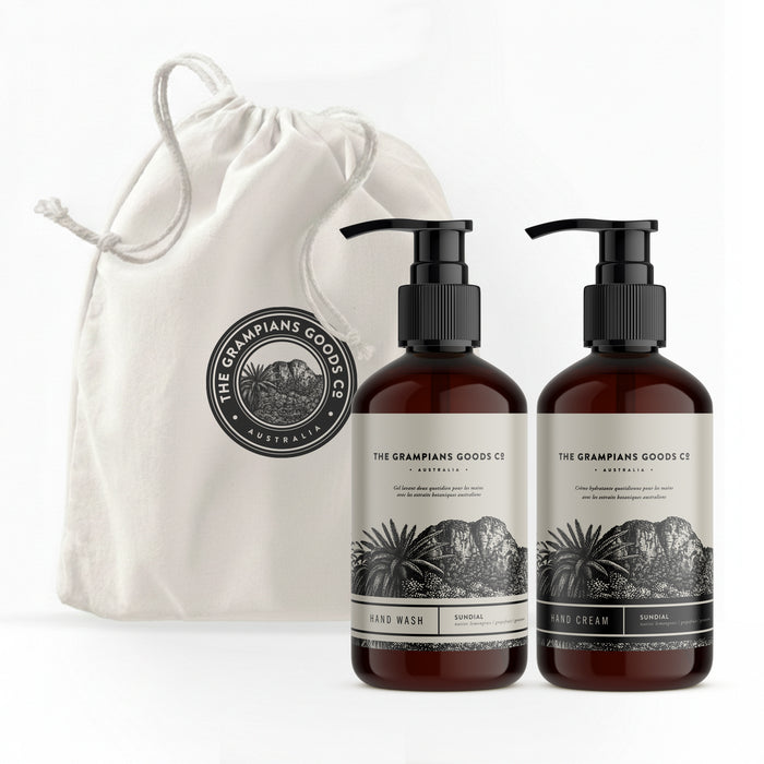 Two bottles of 'The Grampians Goods Co' hand wash and cream with a drawstring bag on a white background.